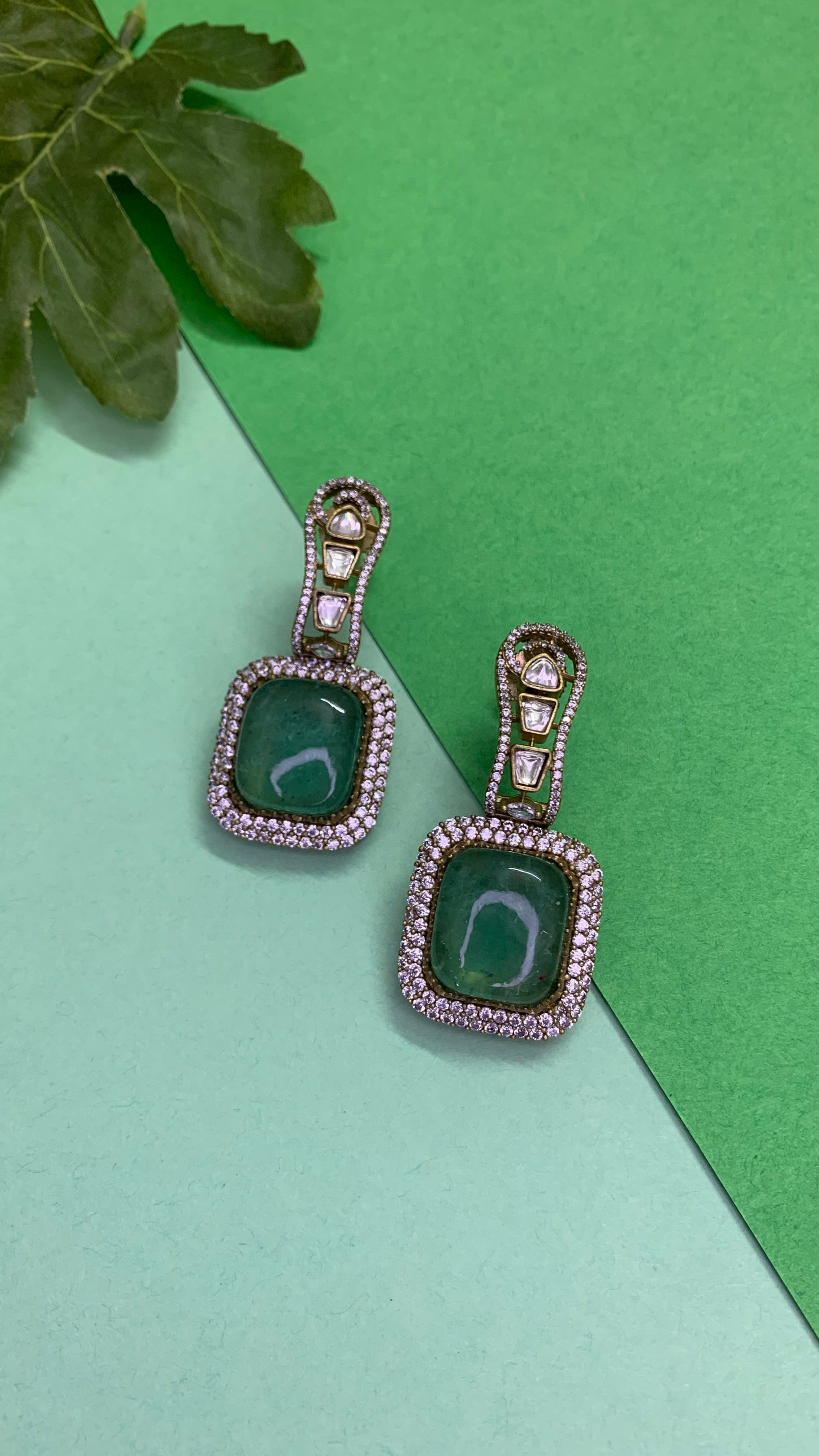 Ozel Gold Plated Kundan Moissonite Polki and American Diamonds Green Stone Earrings