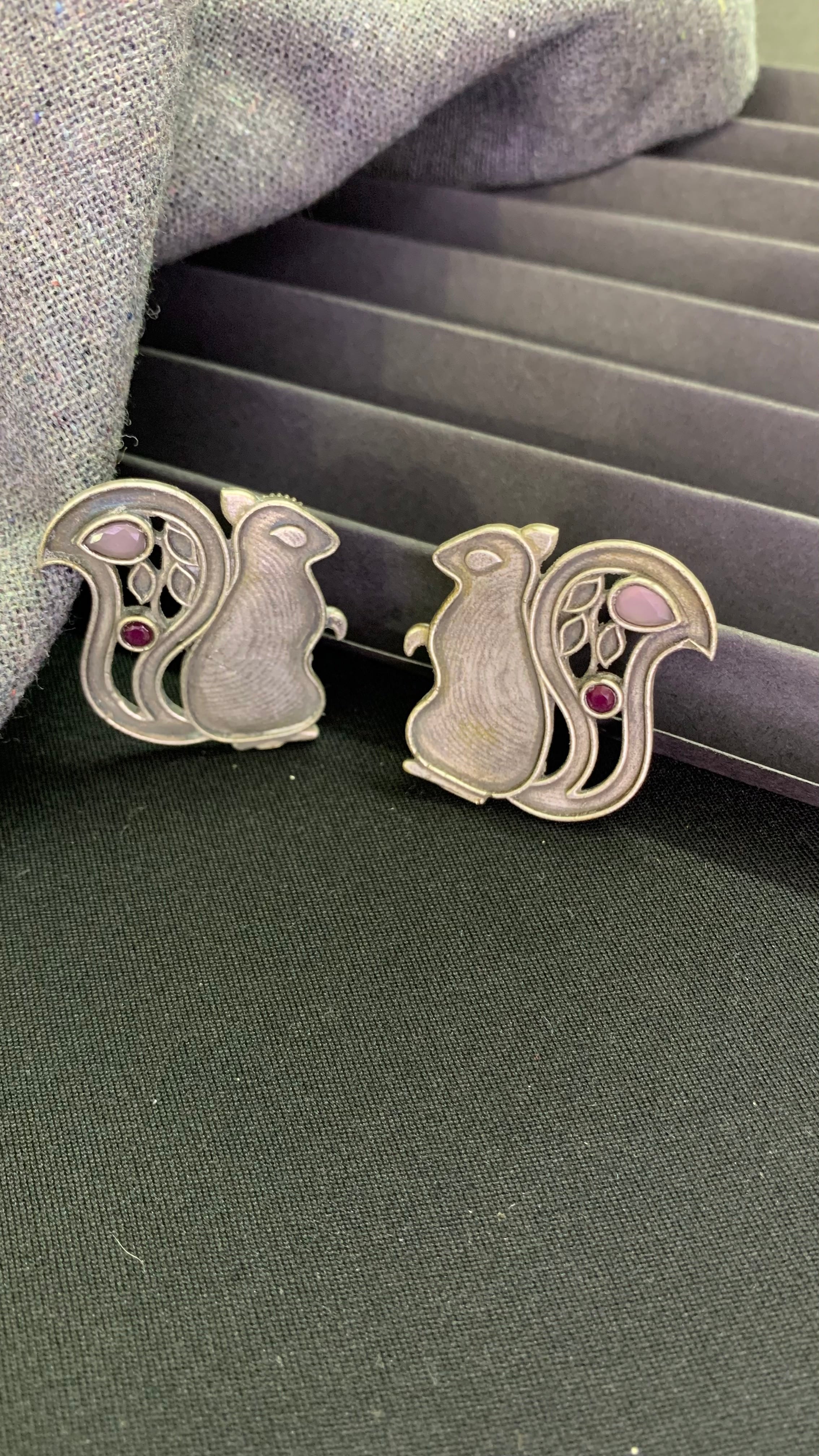 OZEL OXIDISED SILVER PLATED WITH RED STONE SQUIRREL SHAPED EAR STUDS