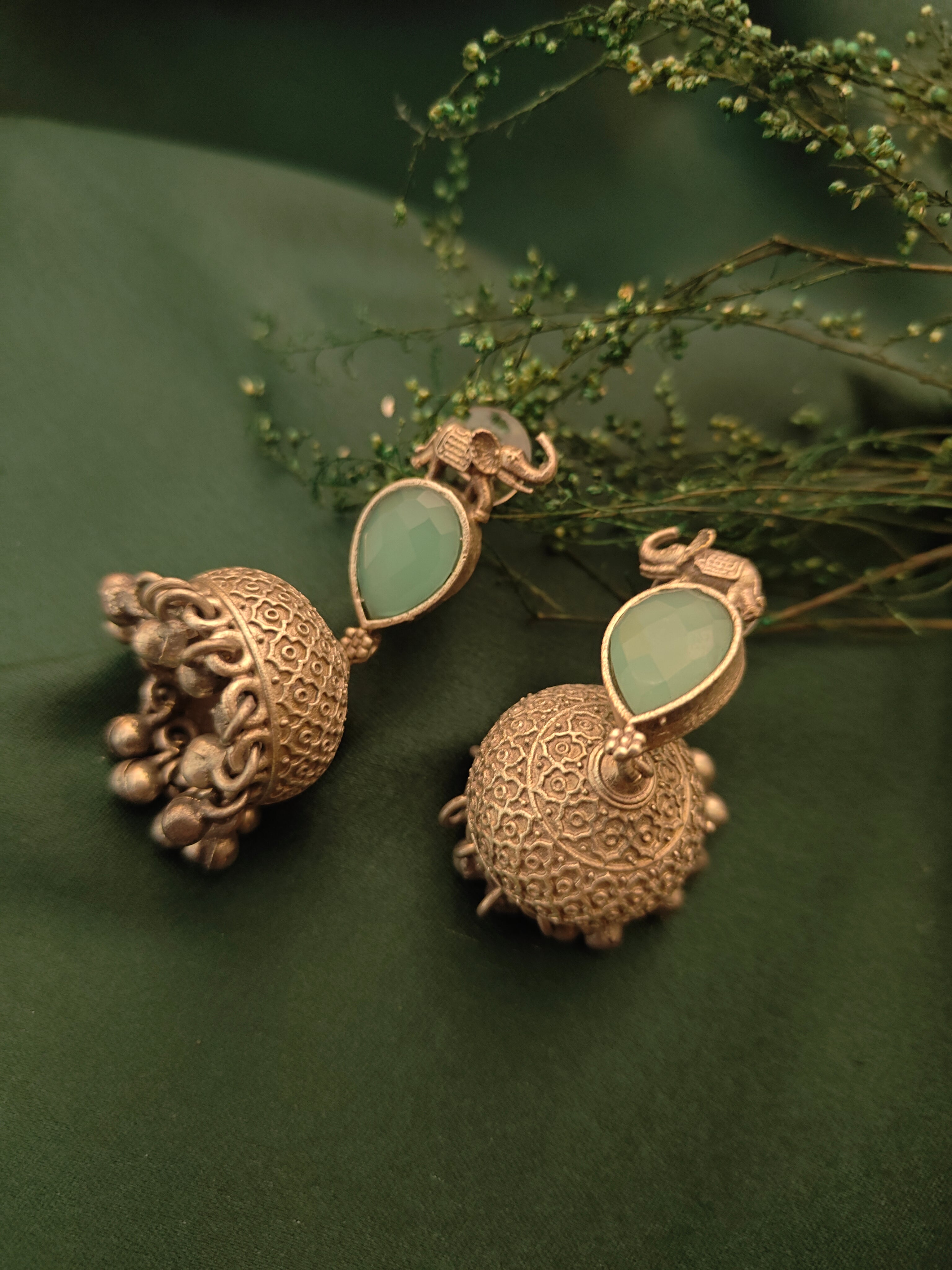 Ozel Mint Green Oxidised Silver Plated Jhumka Earrings