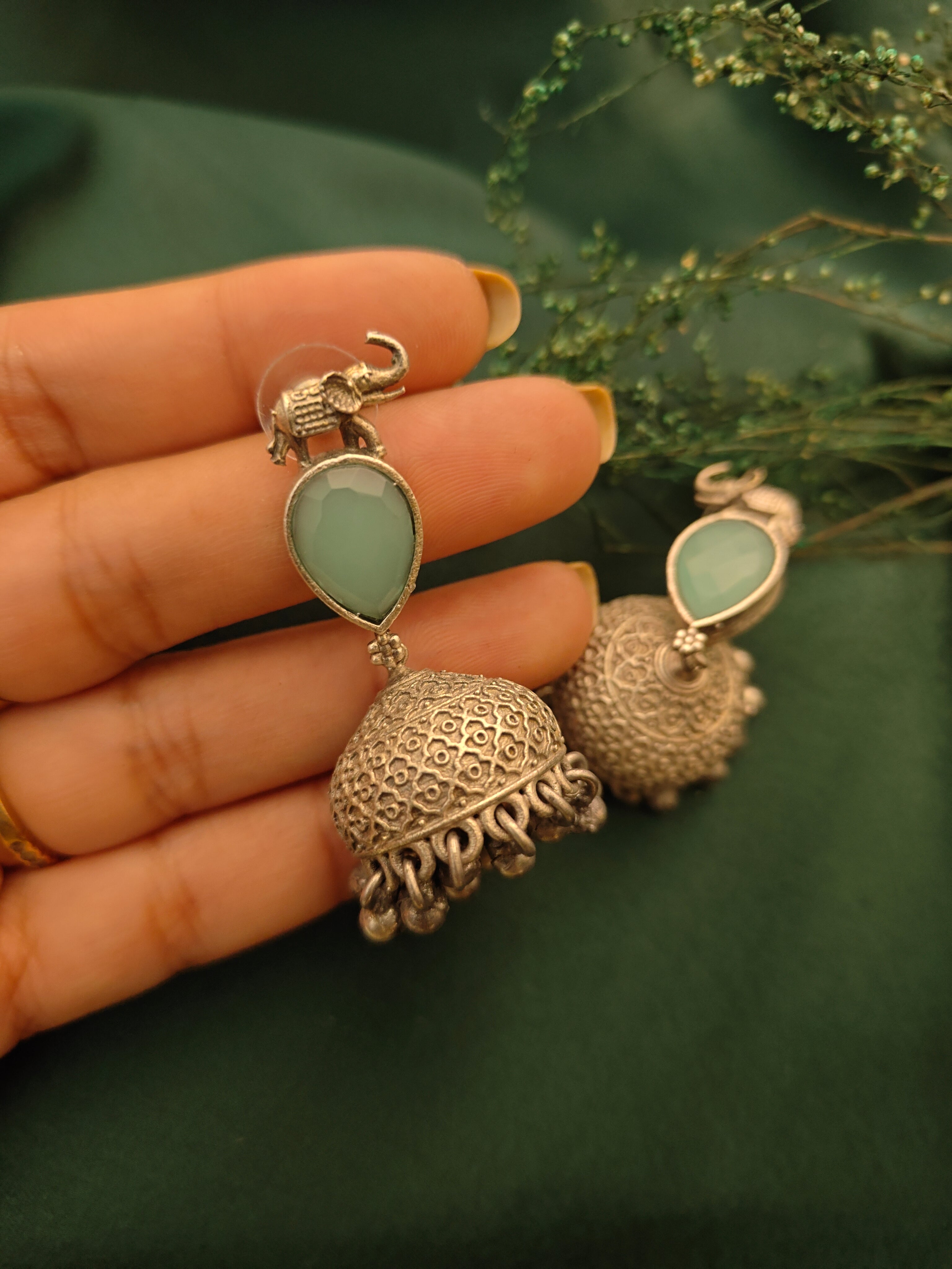 Ozel Mint Green Oxidised Silver Plated Jhumka Earrings