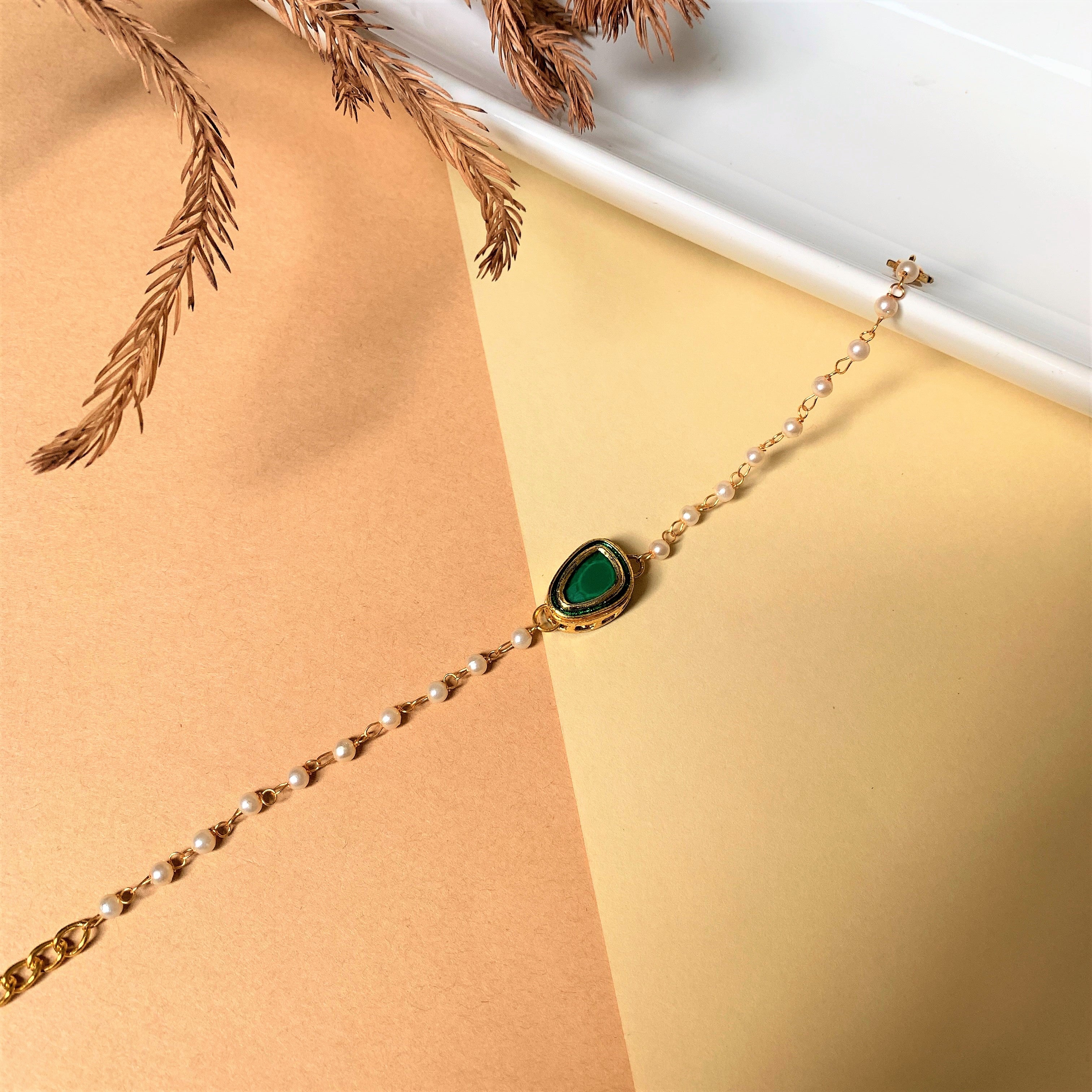 GREEN KUNDAN BRACELET WITH PEARL STRING