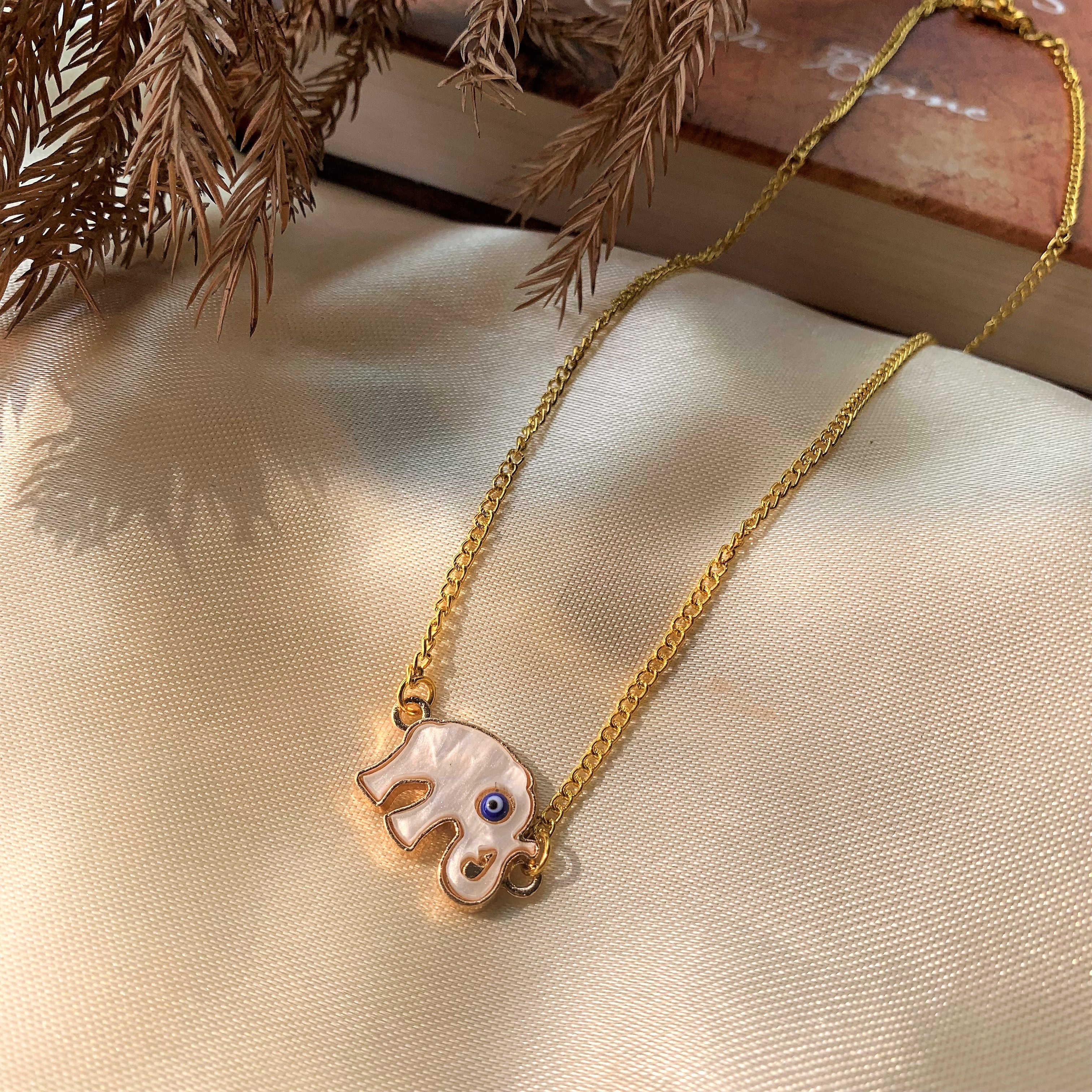 Evil Eye Pendant with Elephant Element on Mother of Pearl