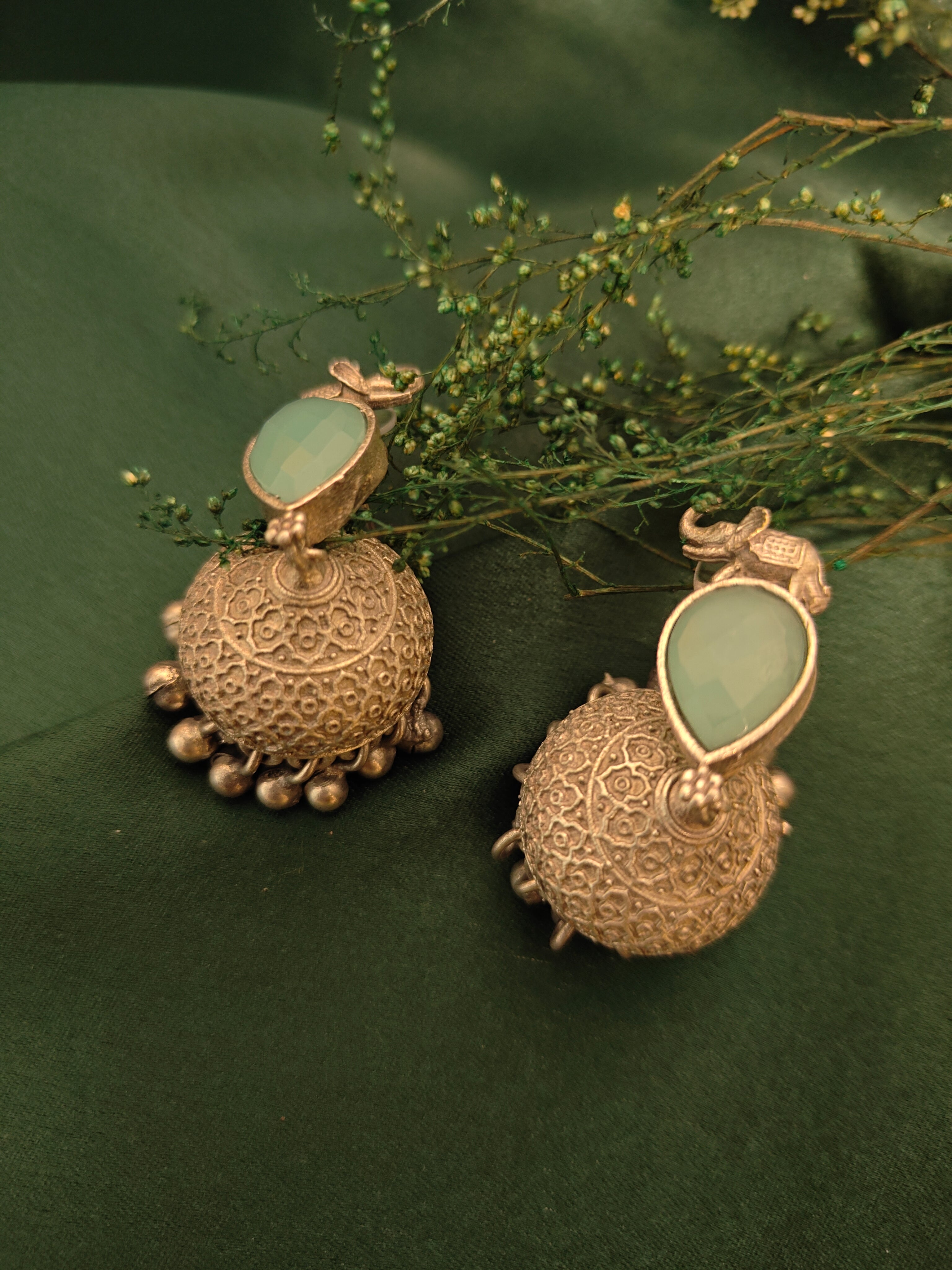 Ozel Mint Green Oxidised Silver Plated Jhumka Earrings