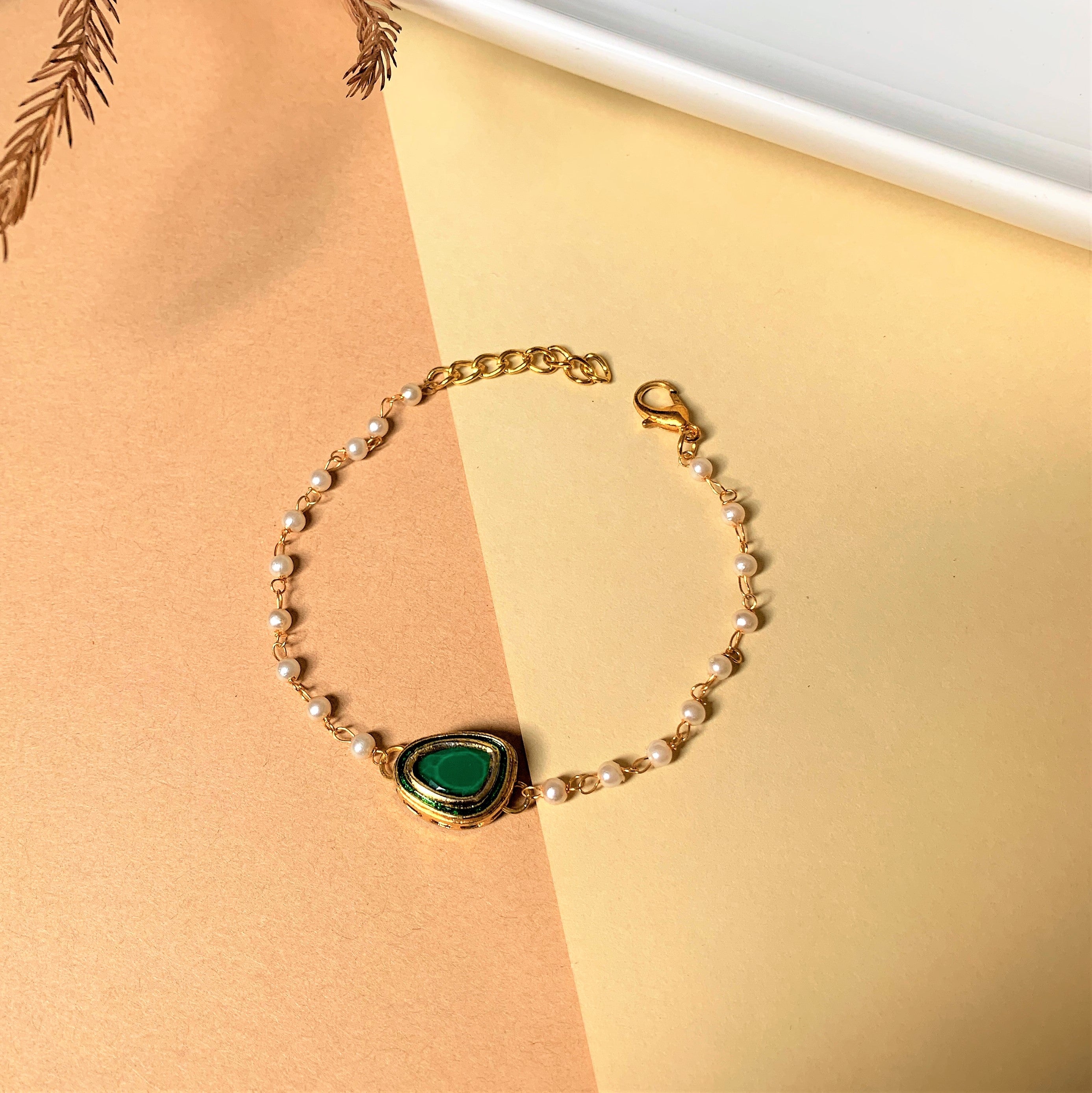 GREEN KUNDAN BRACELET WITH PEARL STRING