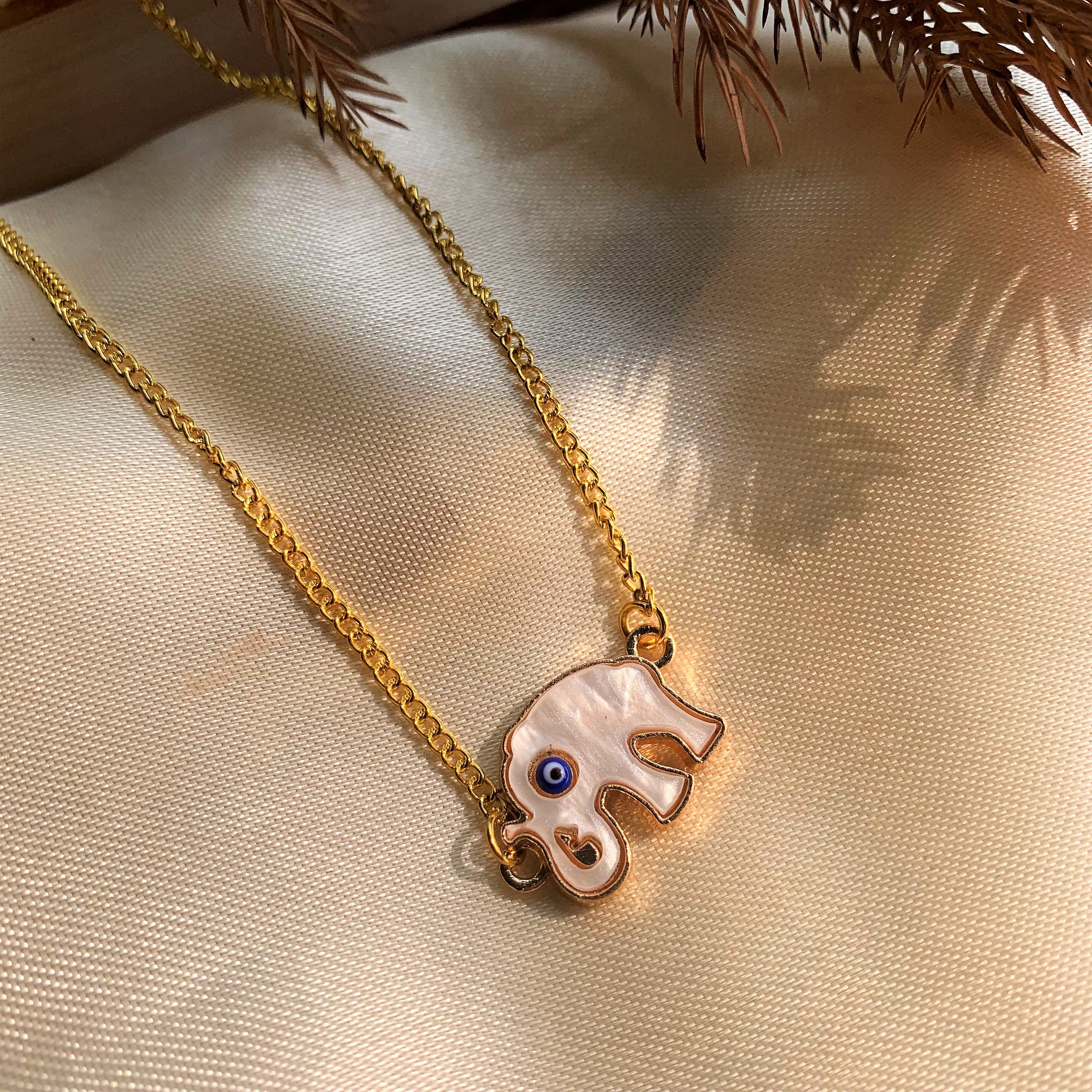 Evil Eye Pendant with Elephant Element on Mother of Pearl