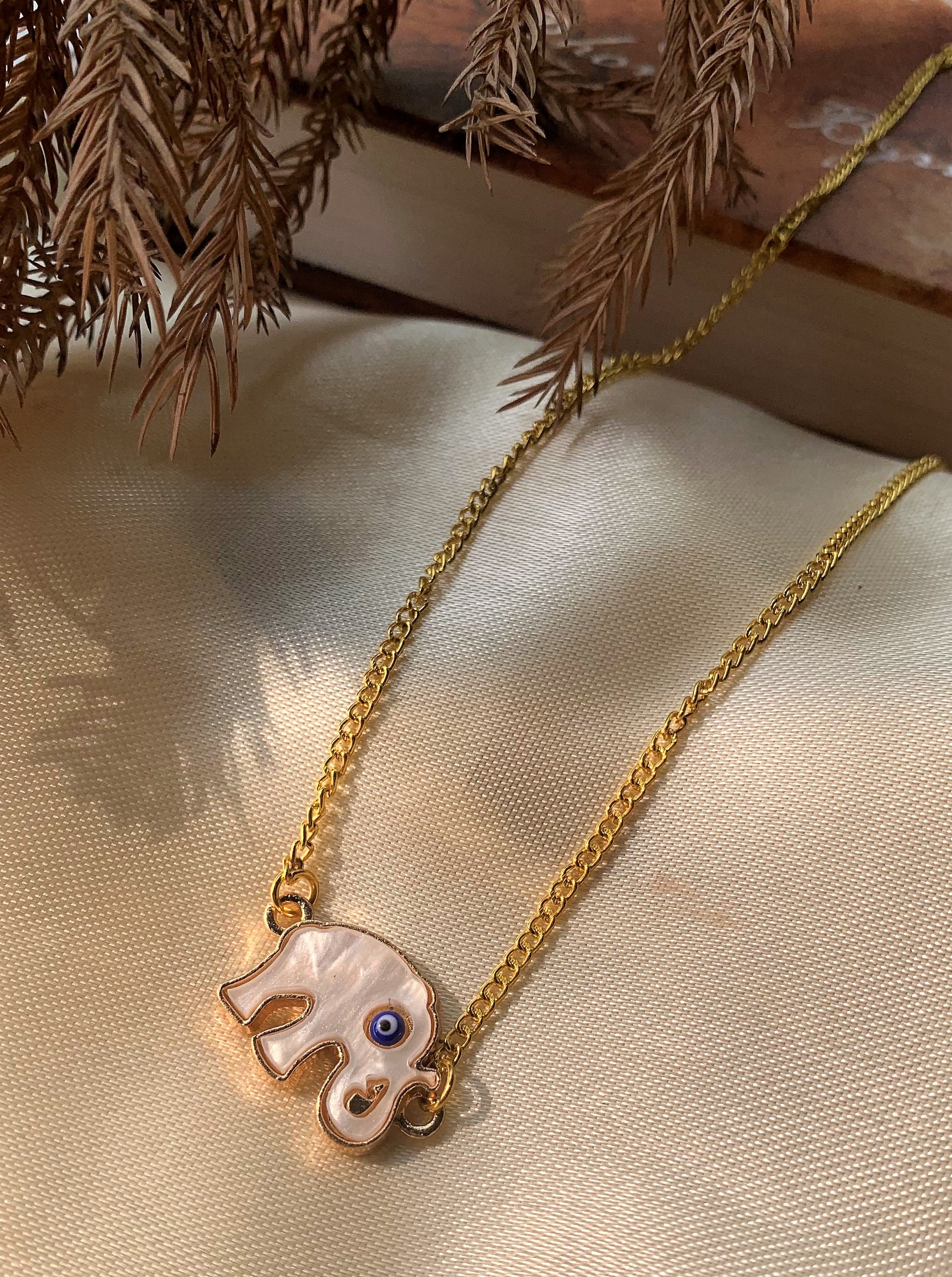 Evil Eye Pendant with Elephant Element on Mother of Pearl